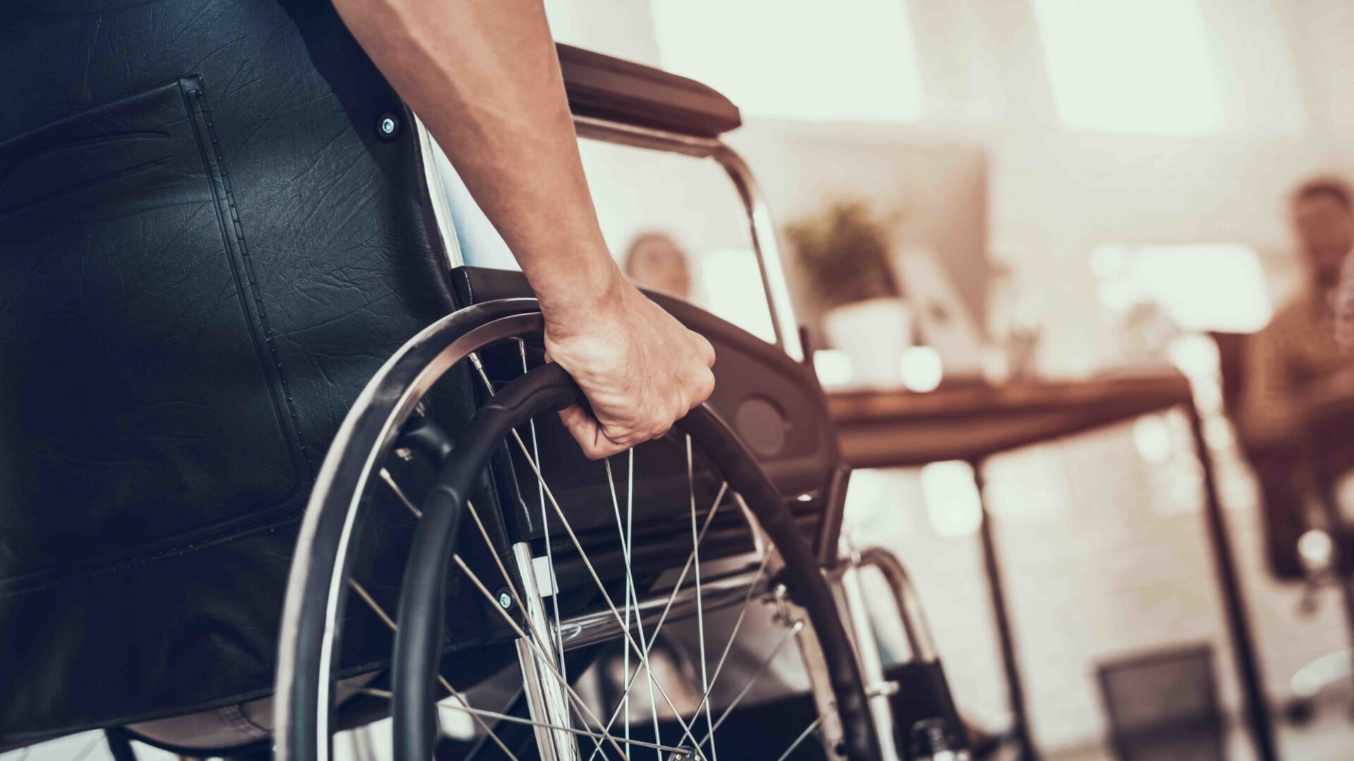 man in wheelchair with blurred background